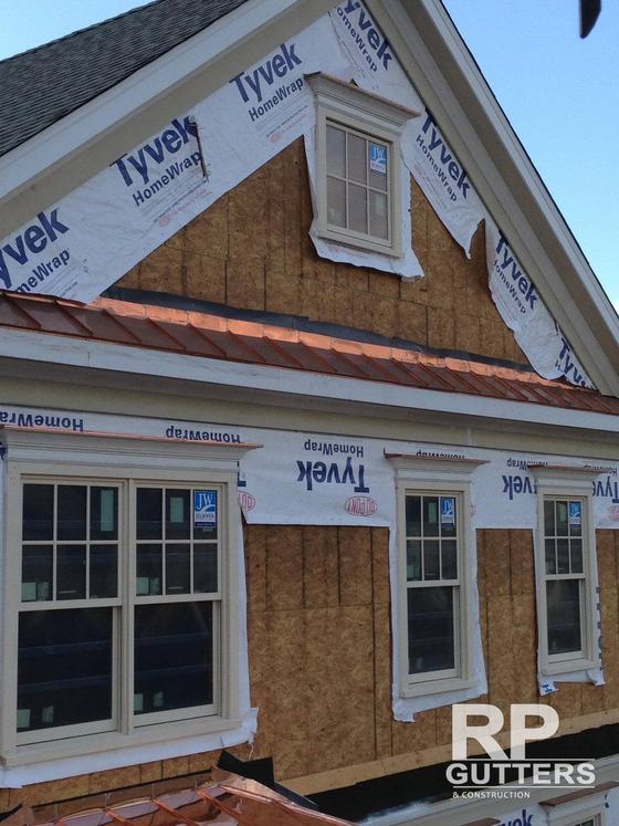 Copper roof edge over windows during construction
