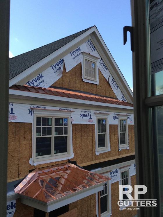 Copper roof over windows on a home under construction