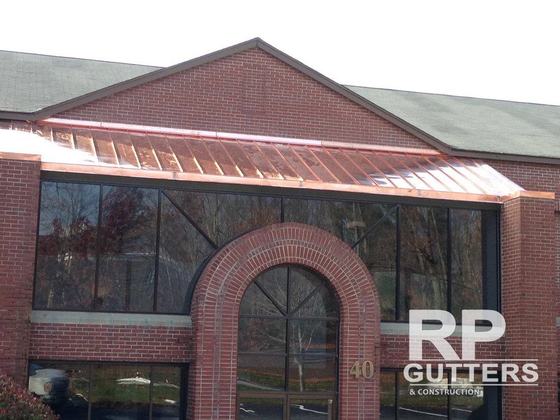 Brick building with a copper entry roof