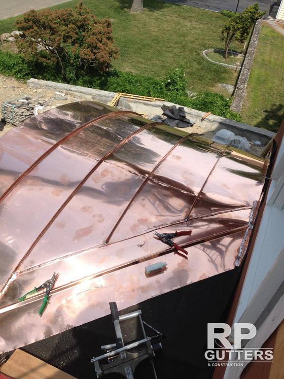 Curved copper roof panels