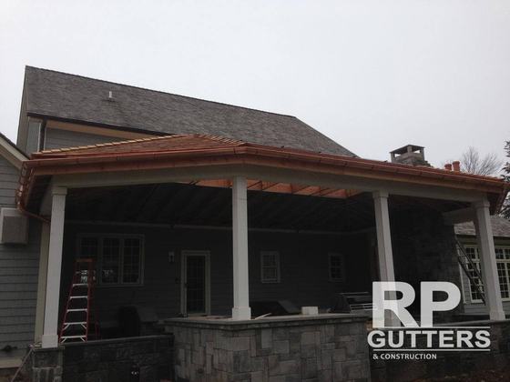 Copper roof over a covered porch