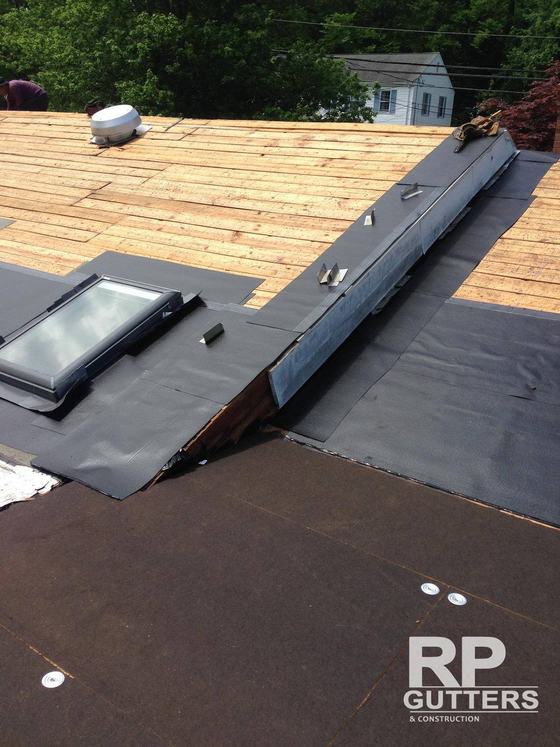 Skylight curb and underlayment on a new roof