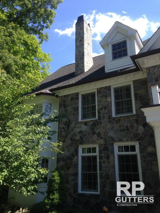 Stone home with new roofing