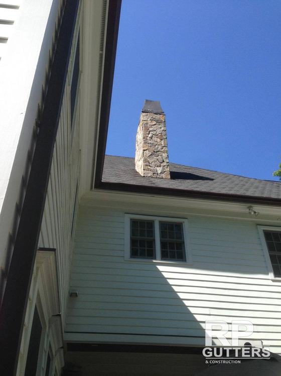 Gutter and chimney on a clapboard home