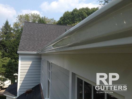 White seamless gutter along the eave