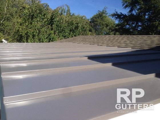 Gray standing-seam metal roof panels