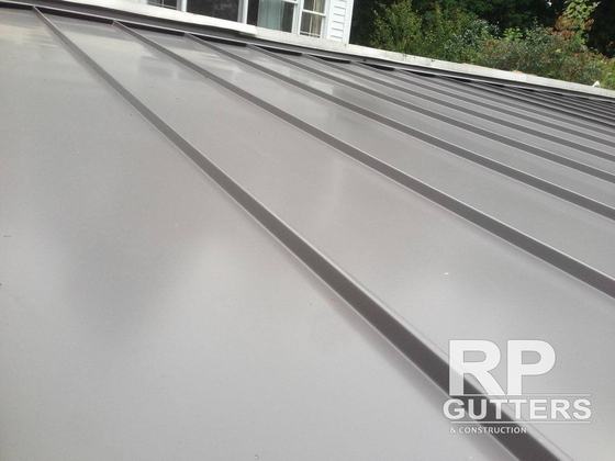 Gray standing-seam metal roof seams