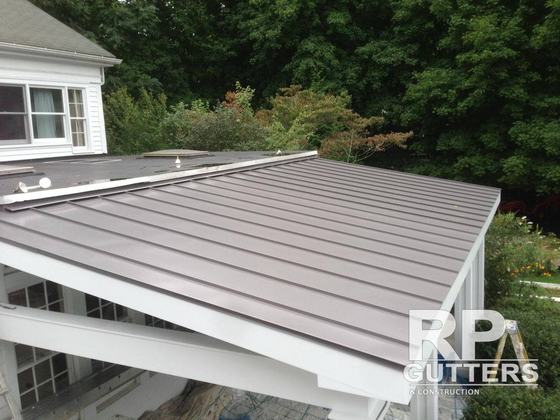 Gray metal roof over an addition